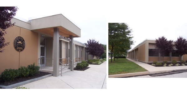 Exterior renovations of school district administration offices with restoration of concrete facade.